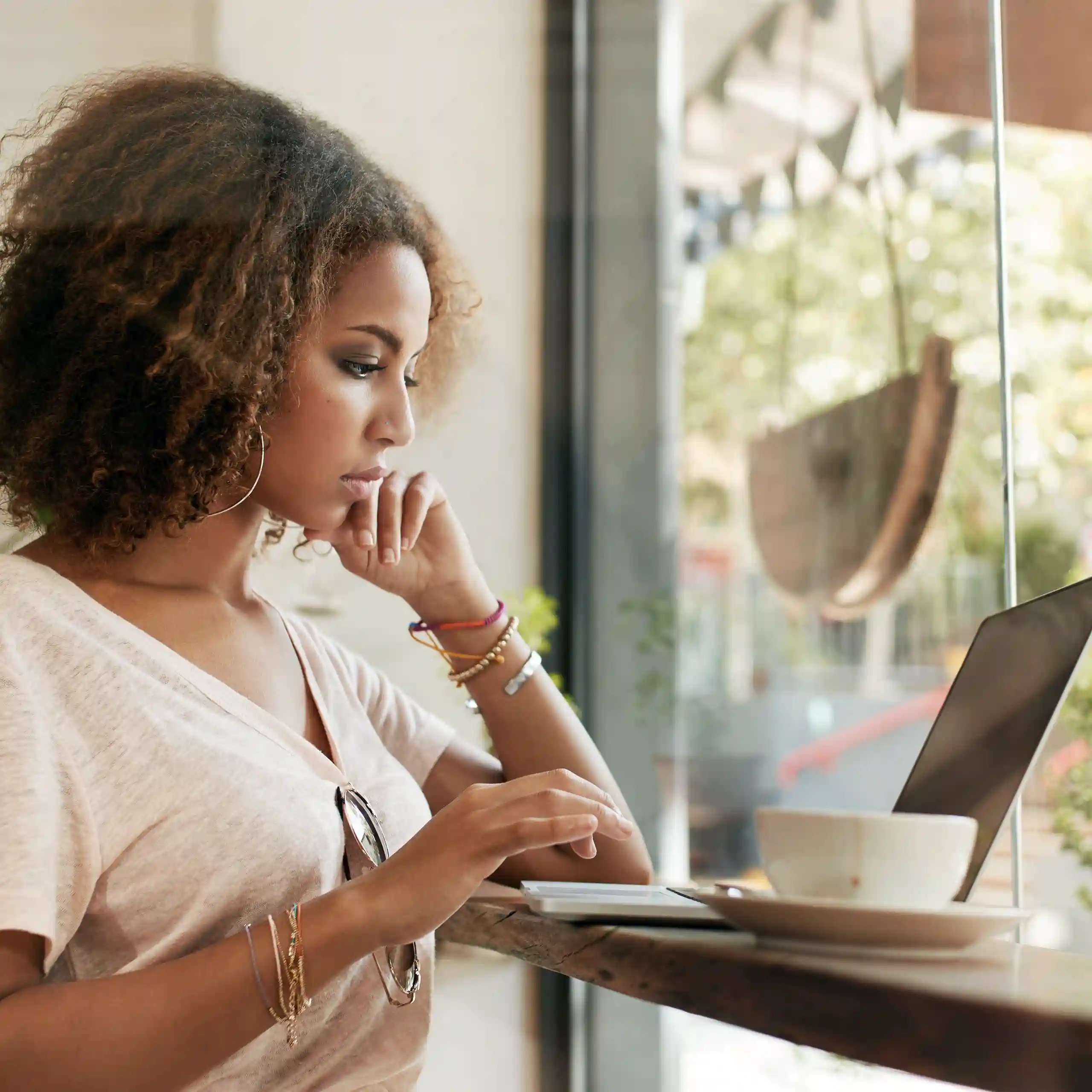 Woman managing her online store using a laptop Woman managing her online store using a laptop